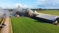 Loods in Terheijden met landbouwmachines in brand, brandweer voorkomt erger